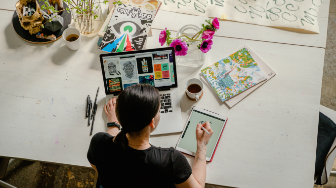 Woman at a desk working on a laptop