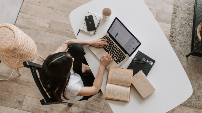 Woman using a laptop on a desk