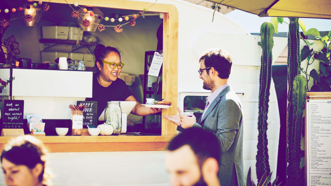 Buying goods from a food stall and paying by card